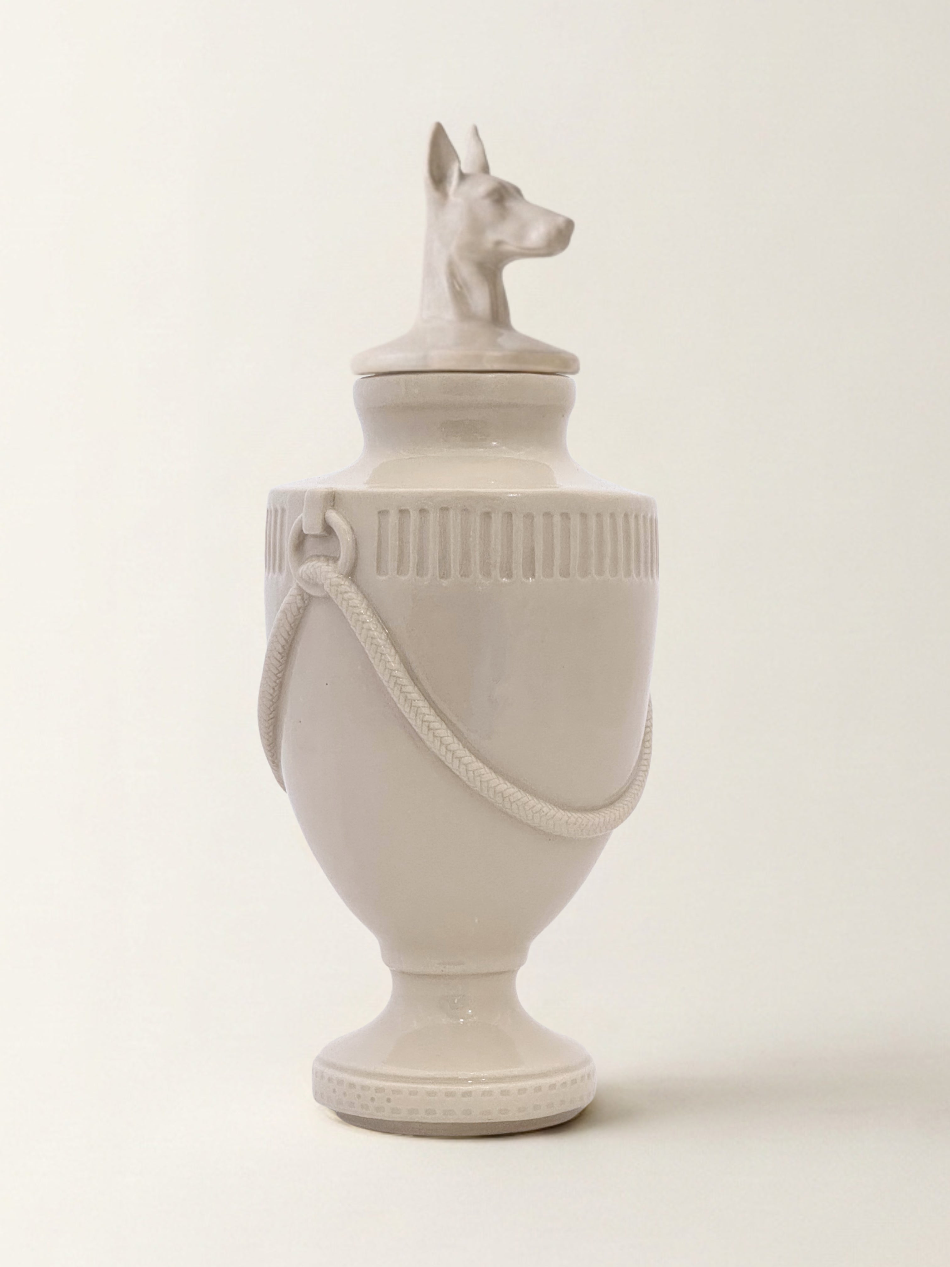 Ceramic pet memorial urn with Doberman figure at the crown, handcrafted porcelain dog urn