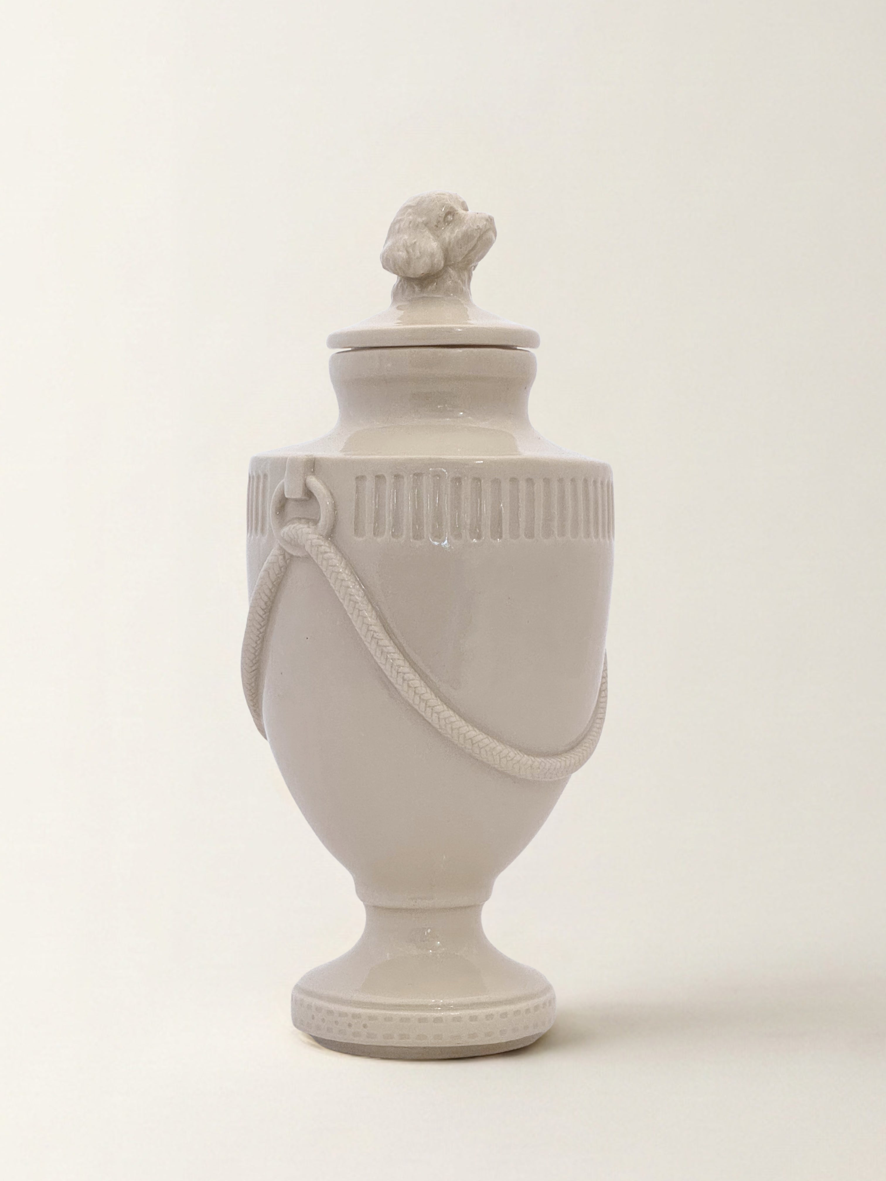 Ceramic pet memorial urn with Doodle figure at the crown, handcrafted porcelain dog urn