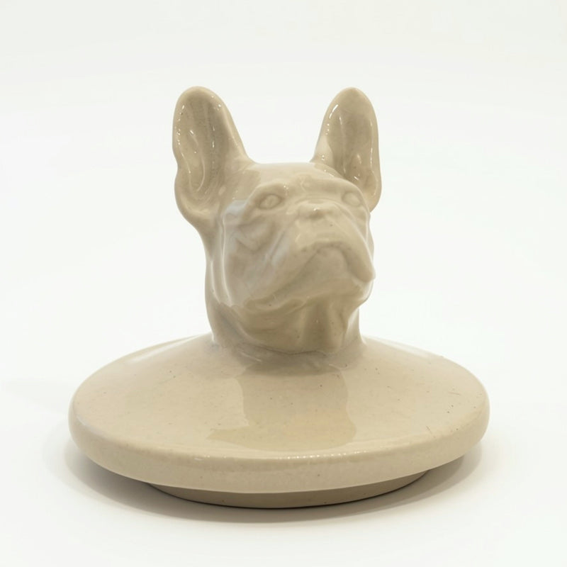 Close-up of hand-sculpted French Bulldog figure on ceramic urn lid