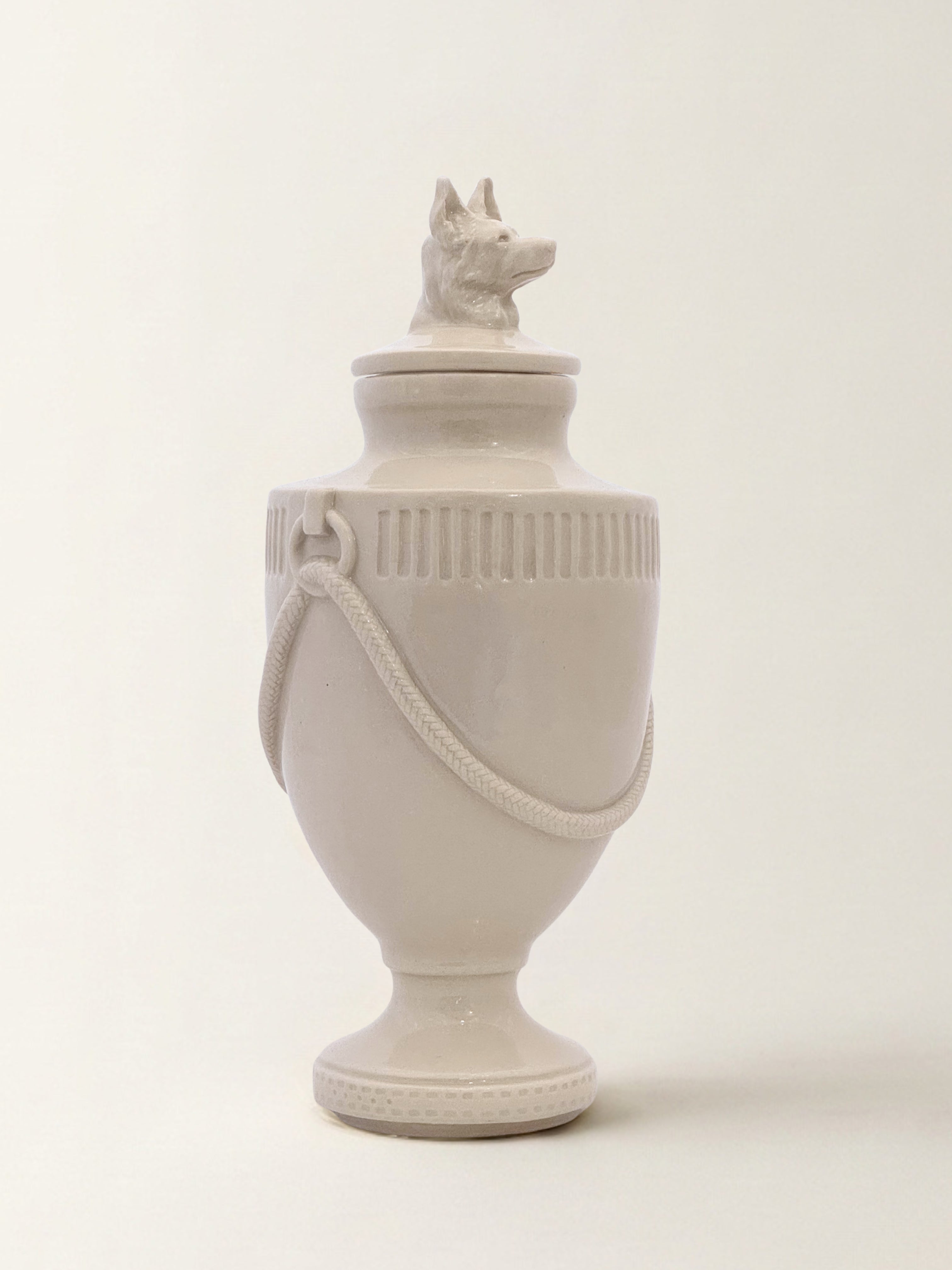 Ceramic pet memorial urn with Shepherd figure at the crown, handcrafted porcelain dog urn